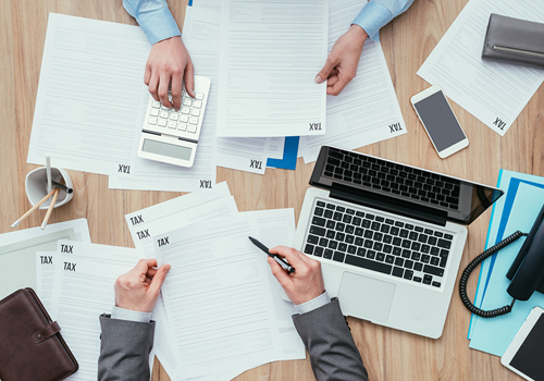 Business People Checking Tax Forms